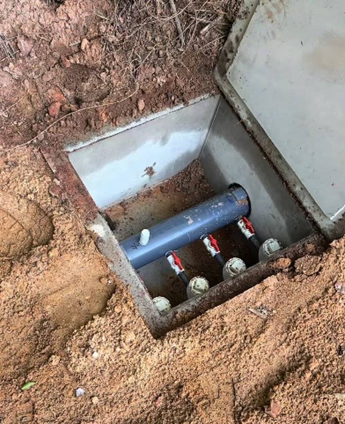 Distribution box valve and pipe connections during a septic repair in Troutman, NC